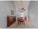 Formal dining room with wood table and chairs, and built-in shelving at 13872 N 89Th St, Scottsdale, AZ 85260