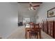 Dining room features a wood table and chairs, and access to living room at 13872 N 89Th St, Scottsdale, AZ 85260