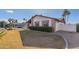 Side view of the house with mature landscaping and a partial view of the backyard at 13872 N 89Th St, Scottsdale, AZ 85260