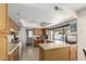 Galley-style kitchen with wood cabinets and ample counter space at 13872 N 89Th St, Scottsdale, AZ 85260