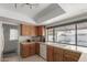 Kitchen with a breakfast bar, stainless steel appliances, and a view to the backyard at 13872 N 89Th St, Scottsdale, AZ 85260