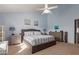 Main bedroom with king-size bed, and large window with natural light at 13872 N 89Th St, Scottsdale, AZ 85260