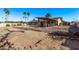 Expansive backyard with a rock border and lush landscaping at 1518 N 62Nd Pl, Mesa, AZ 85205