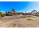 Large backyard featuring a rock wall and a sparkling pool at 1518 N 62Nd Pl, Mesa, AZ 85205