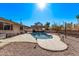 Spacious backyard oasis featuring a kidney-shaped pool and patio at 1518 N 62Nd Pl, Mesa, AZ 85205