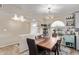 Dining area with wood table and view to kitchen at 1518 N 62Nd Pl, Mesa, AZ 85205