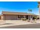 Single-story home with landscaped yard and two-car garage at 1518 N 62Nd Pl, Mesa, AZ 85205