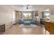 Living room with curved sofa and view of kitchen at 1518 N 62Nd Pl, Mesa, AZ 85205