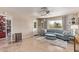 Living room featuring a curved sofa and access to the kitchen at 1518 N 62Nd Pl, Mesa, AZ 85205