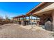 Relaxing patio area with covered seating and a view of the pool at 1518 N 62Nd Pl, Mesa, AZ 85205