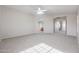 Bright bedroom featuring a ceiling fan and en-suite bathroom access at 16370 W Adams St, Goodyear, AZ 85338