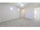 Bedroom with a walk-in closet and access to a hallway at 16370 W Adams St, Goodyear, AZ 85338