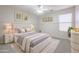 Stylish bedroom with a white bed frame and grey bedding at 16370 W Adams St, Goodyear, AZ 85338