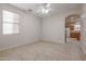 Spacious dining area with tile floors and an archway to the kitchen at 16370 W Adams St, Goodyear, AZ 85338