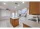 Open kitchen with an island and views into the adjacent living room at 16370 W Adams St, Goodyear, AZ 85338