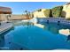 Inviting backyard pool with waterfall feature at 16370 W Adams St, Goodyear, AZ 85338