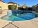 Relaxing kidney-shaped pool in sunny backyard at 16370 W Adams St, Goodyear, AZ 85338