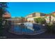 Inviting kidney-shaped pool with safety fence at 16370 W Adams St, Goodyear, AZ 85338