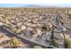 Aerial view showcasing house, neighborhood, and surrounding landscape at 16765 W Hadley St, Goodyear, AZ 85338