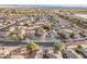 Aerial view showcasing house, neighborhood, and surrounding landscape at 16765 W Hadley St, Goodyear, AZ 85338