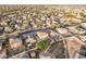 Aerial view showcasing house, neighborhood, and surrounding landscape at 16765 W Hadley St, Goodyear, AZ 85338