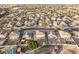 Aerial view showcasing house, neighborhood, and surrounding landscape at 16765 W Hadley St, Goodyear, AZ 85338