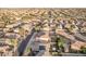 Aerial view showcasing house, neighborhood, and surrounding landscape at 16765 W Hadley St, Goodyear, AZ 85338