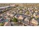 Aerial view showcasing house, neighborhood, and surrounding landscape at 16765 W Hadley St, Goodyear, AZ 85338