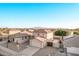 Aerial view of two story house with mountain views at 16765 W Hadley St, Goodyear, AZ 85338