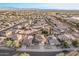 Aerial view showcasing house, neighborhood, and surrounding landscape at 16765 W Hadley St, Goodyear, AZ 85338