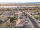 Aerial view showcasing house, neighborhood, and surrounding landscape at 16765 W Hadley St, Goodyear, AZ 85338