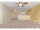 Spacious bedroom with ceiling fan and yellow walls at 16765 W Hadley St, Goodyear, AZ 85338