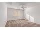 Well-lit bedroom with ceiling fan and window at 16765 W Hadley St, Goodyear, AZ 85338