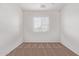 Simple bedroom with carpet and window blinds at 16765 W Hadley St, Goodyear, AZ 85338