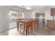 Dining area with sliding glass door to backyard, adjacent to kitchen at 16765 W Hadley St, Goodyear, AZ 85338