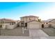 Two-story house with a two-car garage and landscaping at 16765 W Hadley St, Goodyear, AZ 85338