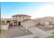 Two-story house with a two-car garage and landscaping at 16765 W Hadley St, Goodyear, AZ 85338