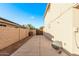 Side yard with concrete pathway and gated access at 16765 W Hadley St, Goodyear, AZ 85338