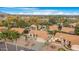 Aerial view showcasing a neighborhood with multiple houses, lush trees, and a tranquil atmosphere at 17014 E De Anza Dr, Fountain Hills, AZ 85268