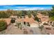 Aerial view of a single-story house with tile roof, desert landscaping, and a two-car garage at 17014 E De Anza Dr, Fountain Hills, AZ 85268