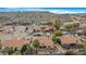 Aerial view of houses in a neighborhood nestled against a mountain backdrop, showcasing desert landscaping at 17014 E De Anza Dr, Fountain Hills, AZ 85268