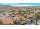 Aerial perspective of a residential area, highlighting a house with a swimming pool and mountain views at 17014 E De Anza Dr, Fountain Hills, AZ 85268