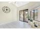 Spacious dining area with a large clock and sliding glass doors at 17014 E De Anza Dr, Fountain Hills, AZ 85268