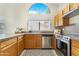 Kitchen with wood cabinets, stainless steel appliances and breakfast bar at 17014 E De Anza Dr, Fountain Hills, AZ 85268