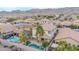 Aerial view showcasing the house, pool, and surrounding landscape at 1715 W Satinwood Dr, Phoenix, AZ 85045