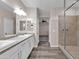 Elegant bathroom with double sinks, a large shower, and modern vanity at 1715 W Satinwood Dr, Phoenix, AZ 85045