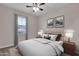 Bright bedroom with ceiling fan and wood nightstands at 1715 W Satinwood Dr, Phoenix, AZ 85045