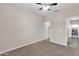 Simple bedroom with carpet, ceiling fan and ample closet space at 1715 W Satinwood Dr, Phoenix, AZ 85045