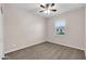 Simple bedroom with carpet, ceiling fan and window at 1715 W Satinwood Dr, Phoenix, AZ 85045