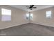 Large bedroom with ceiling fan and plush carpet at 1715 W Satinwood Dr, Phoenix, AZ 85045